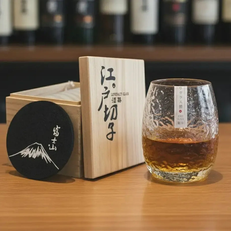 Silkworm whisky glass with wooden gift box and coaster displayed together for gifting.
