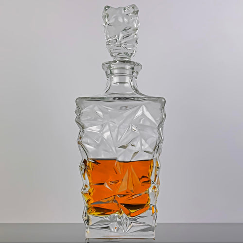 crystal decanter and glass full of strong alcoholic drink, carafe