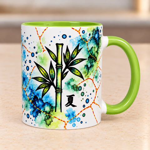Left side of Summer Bamboo ceramic coffee mug displaying green botanical bamboo artwork on glossy white ceramic with a green handle.