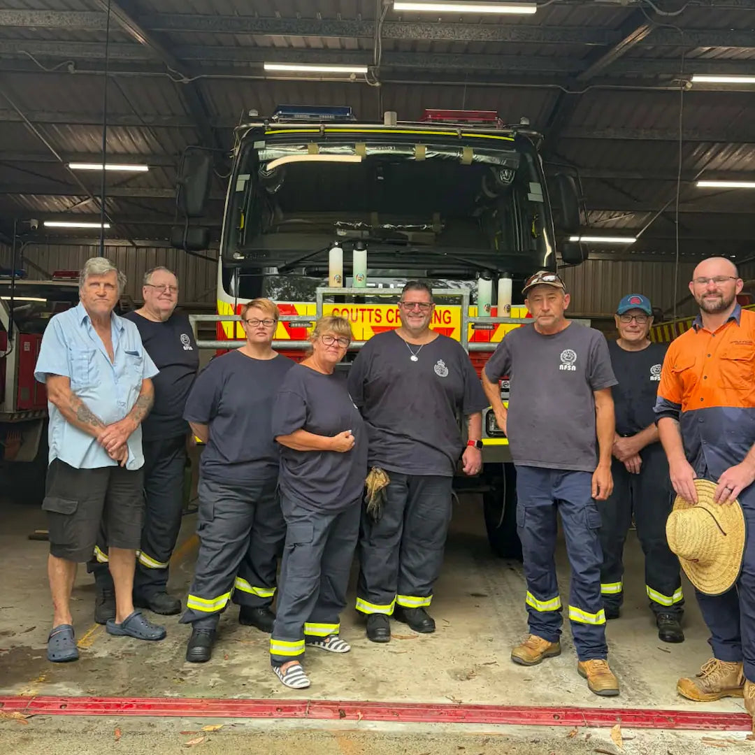 A group of RFS Brigade volunteers at  Coutts Crossing posing with donated solkatt designs drink bottles.