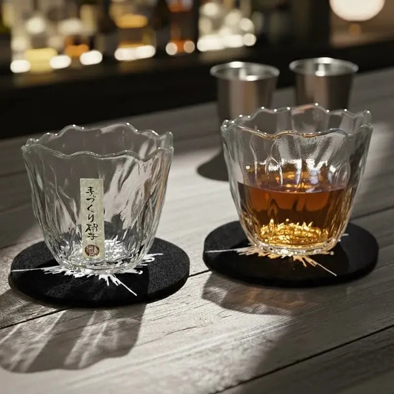 Collection of Japanese Sakura whisky glasses arranged on a bar for display.