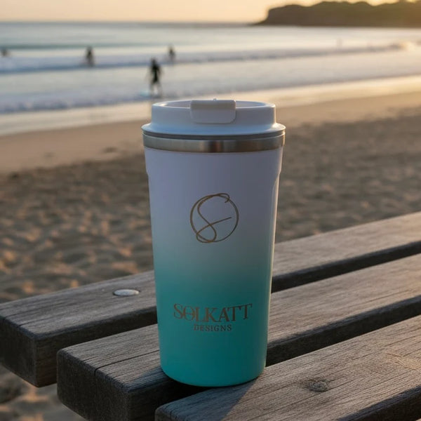 Ocean aqua reusable travel cup by the sea — stainless steel coffee mug made for coastal getaways.