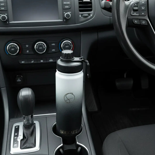 black 650ml drink bottle sitting in a car cupholder - Solkatt Designs