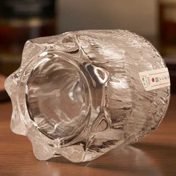 Close-up of crystal Dragon Claw whisky glass highlighting the intricate claw detailing and clear glass texture.