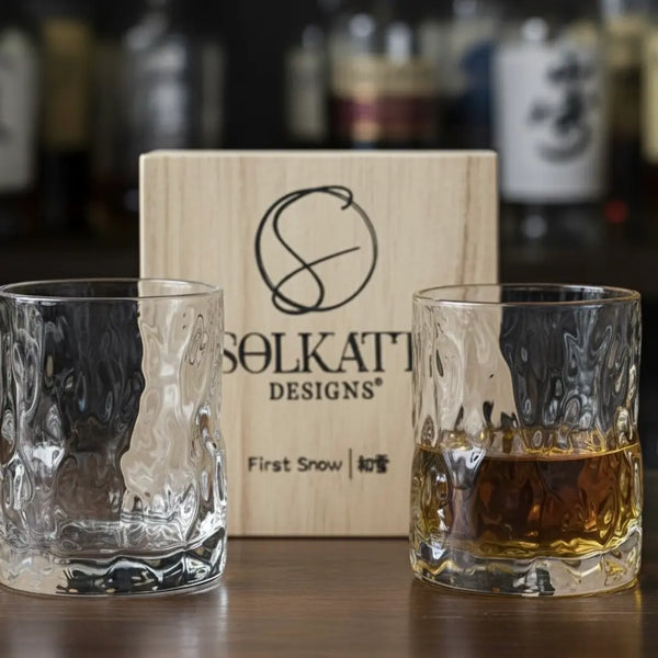 Whisky glass paired with a black foam coaster and gift box, highlighting the full gift set.