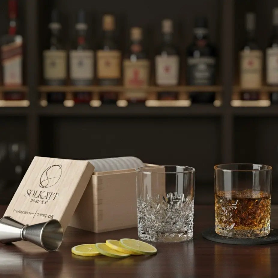 Frosted whisky glass paired with a drink coaster on a bar, combining style and function.