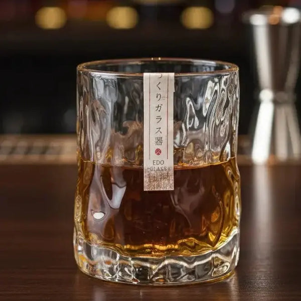 First Snow Whisky Glass with bourbon being poured, showing the amber color against the frosted surface.