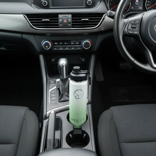 green 650ml drink bottle sitting in a car cupholder - Solkatt Designs