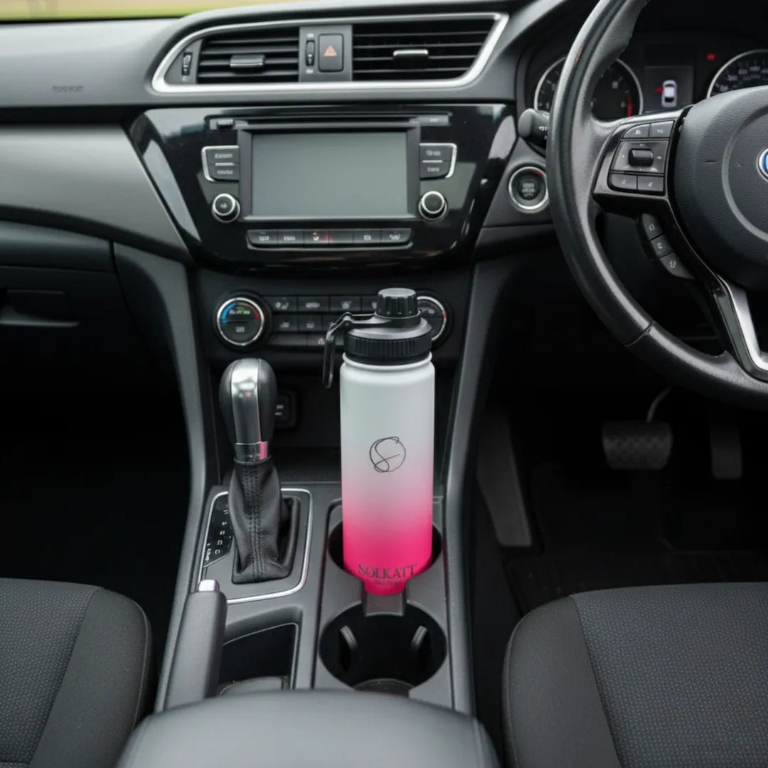 hot pink 650ml drink bottle sitting in a car cupholder - Solkatt Designs