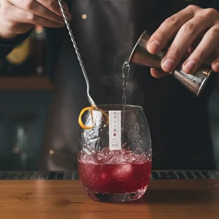 Japanese Silkworm whisky glass featuring a rum-based cocktail on the bar.