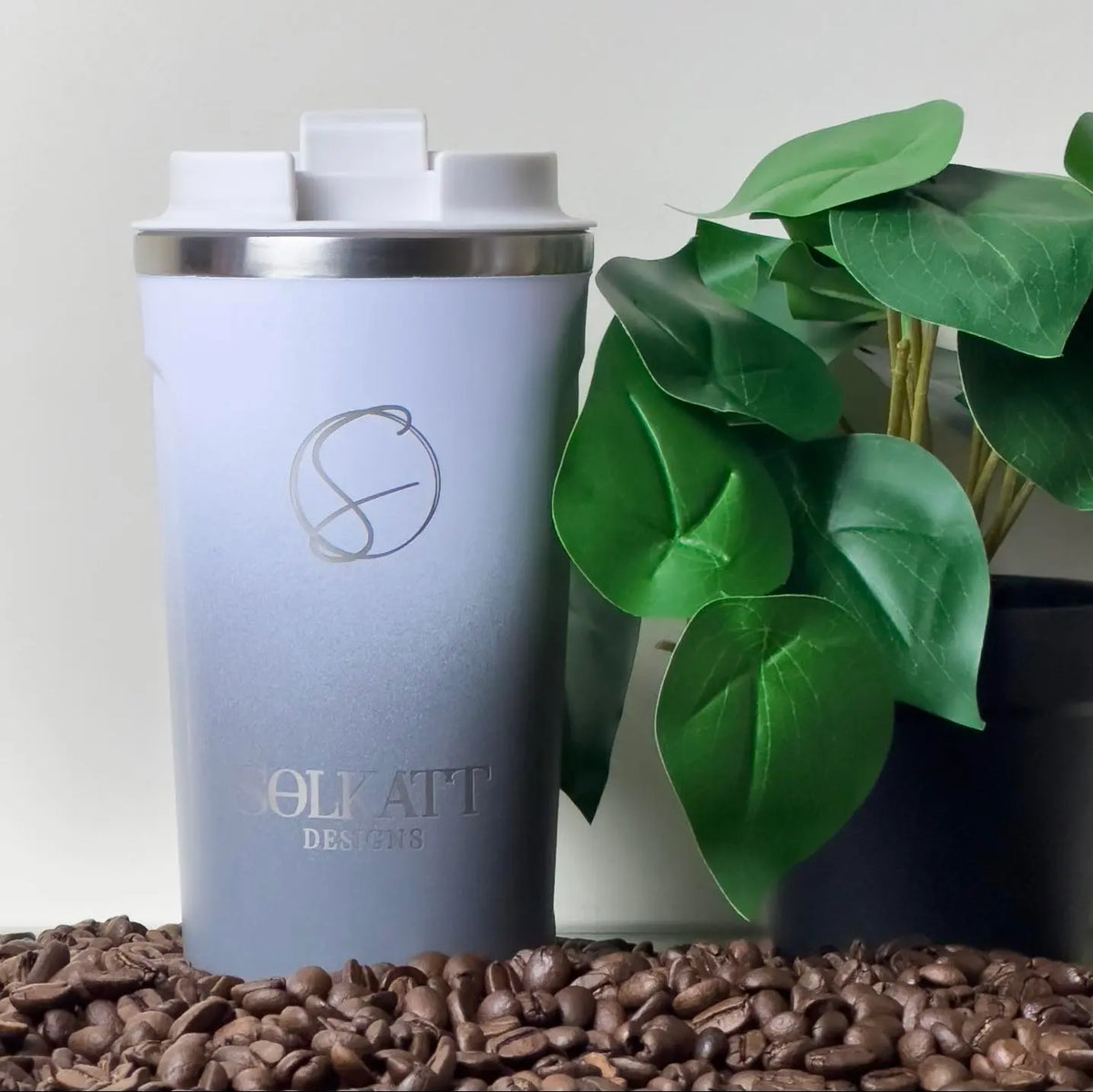 Misty Grey reusable coffee cup on coffee beans – stainless steel travel mug with lid – Solkatt Designs