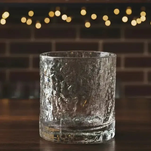 Empty Old Fashion Whisky Glass on a bar, emphasizing its shape and elegant silhouette.