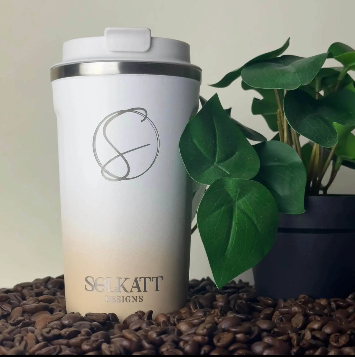 Pastel Beige reusable coffee cup on coffee beans – stainless steel travel mug with lid – Solkatt Designs