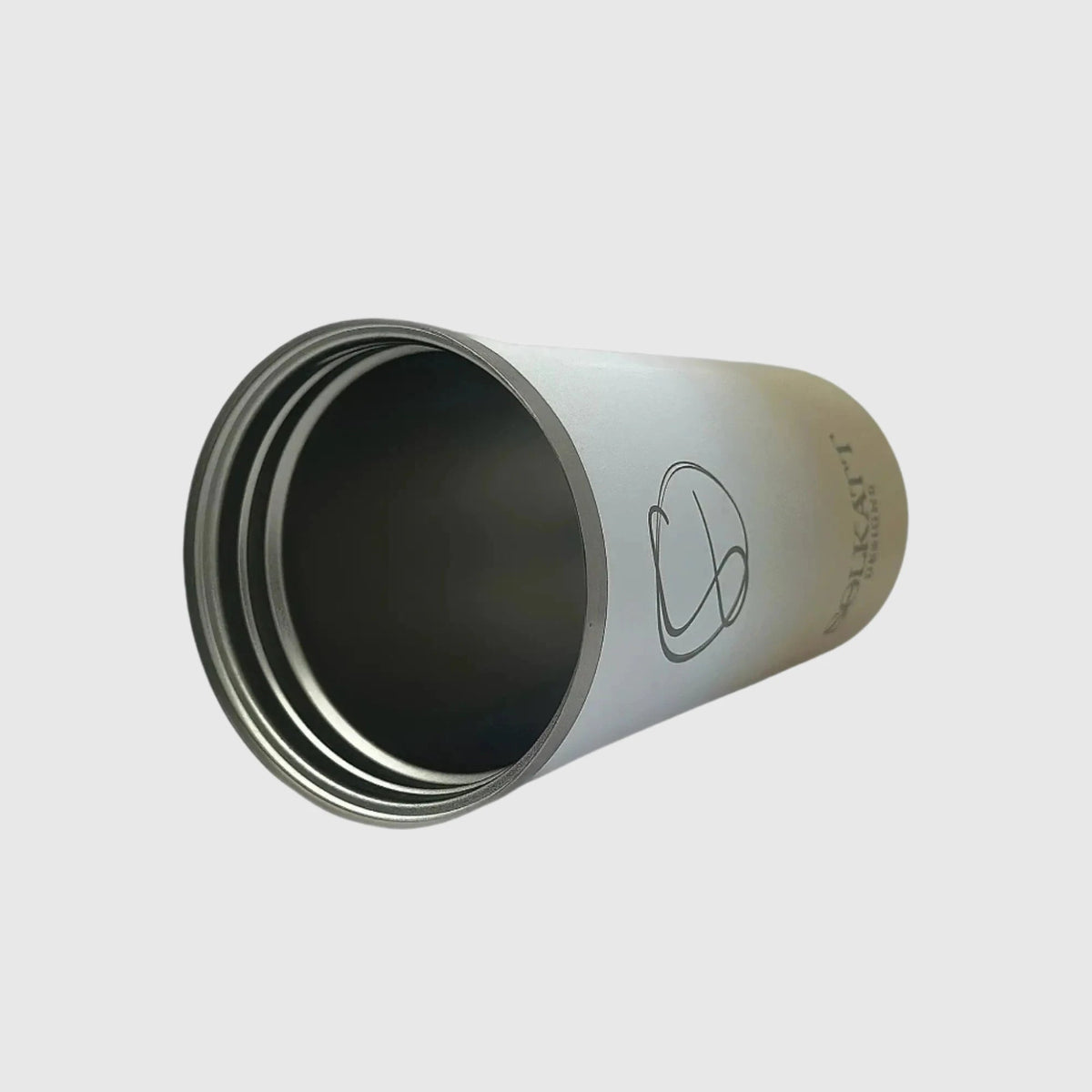 Pastel Beige coffee cup laying on side without lid – Solkatt Designs