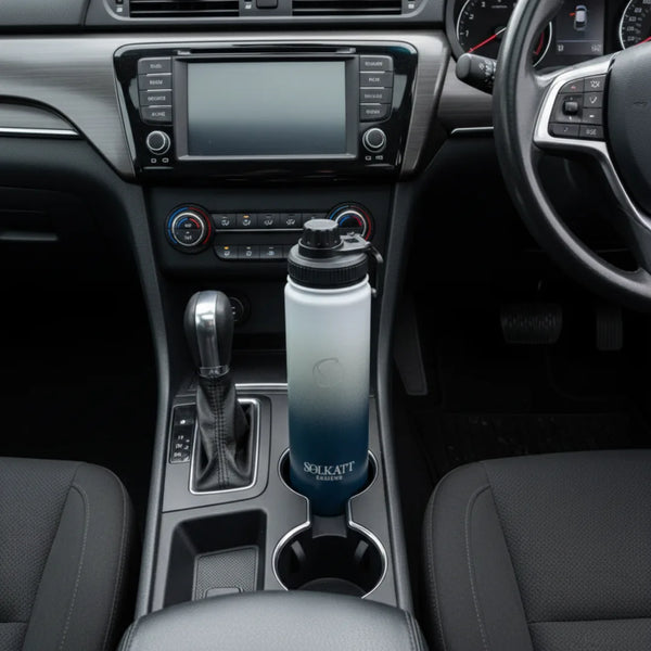 royal blue 650ml drink bottle sitting in a car cupholder - Solkatt Designs